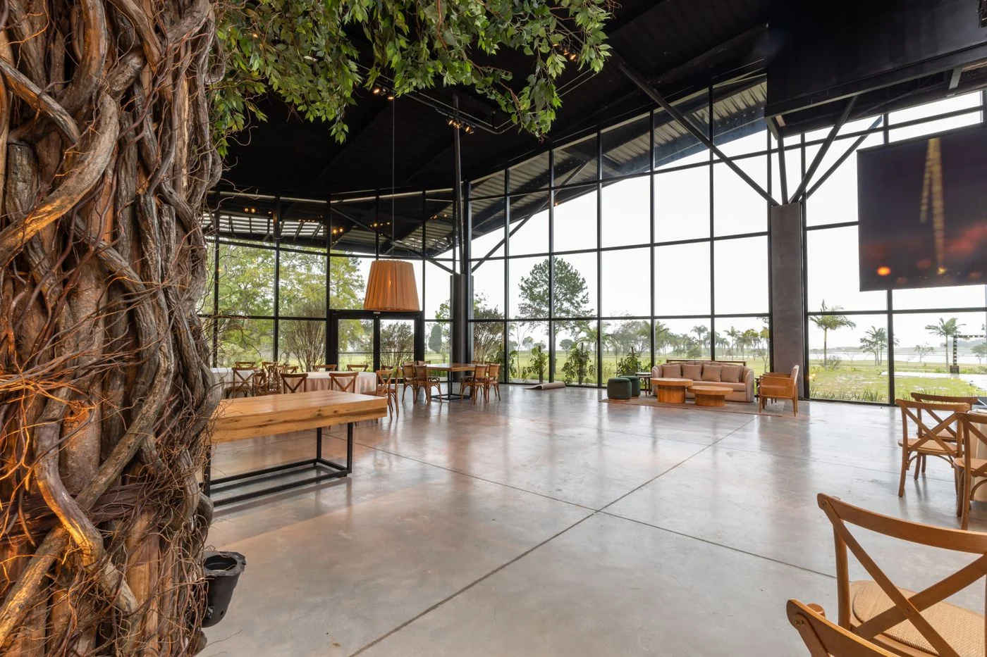 Bright restaurant interior with tables and large windows. — illustrative photograph.